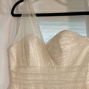 Off white sequence party gown .